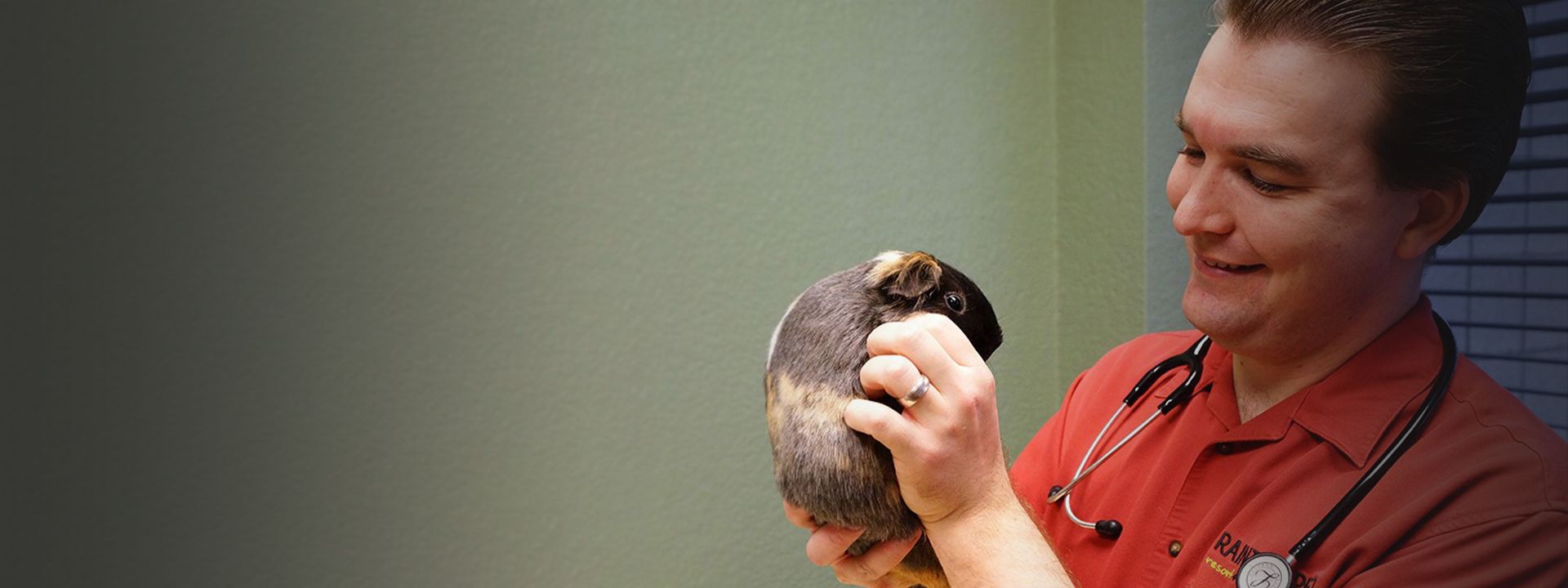 doctor benjamin savard holding a guinea pig