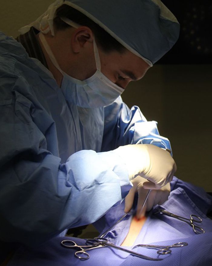 doctor benjamin savard performing sterilization surgery